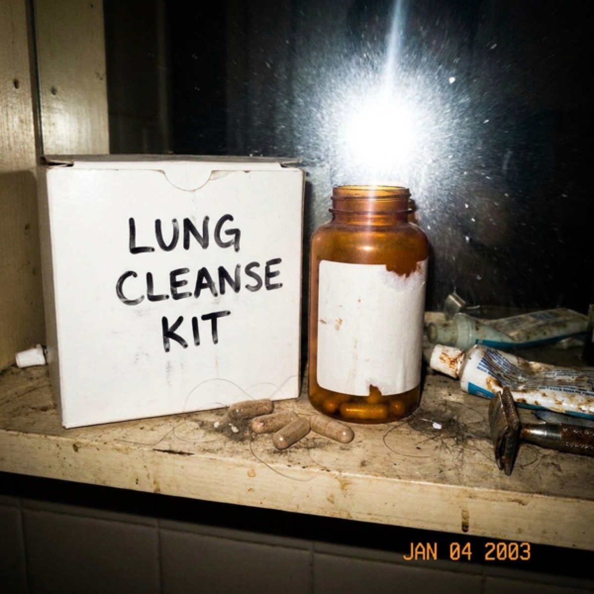 A dusty generic lung detox cleanse kit shoved on a grimy bathroom shelf.
